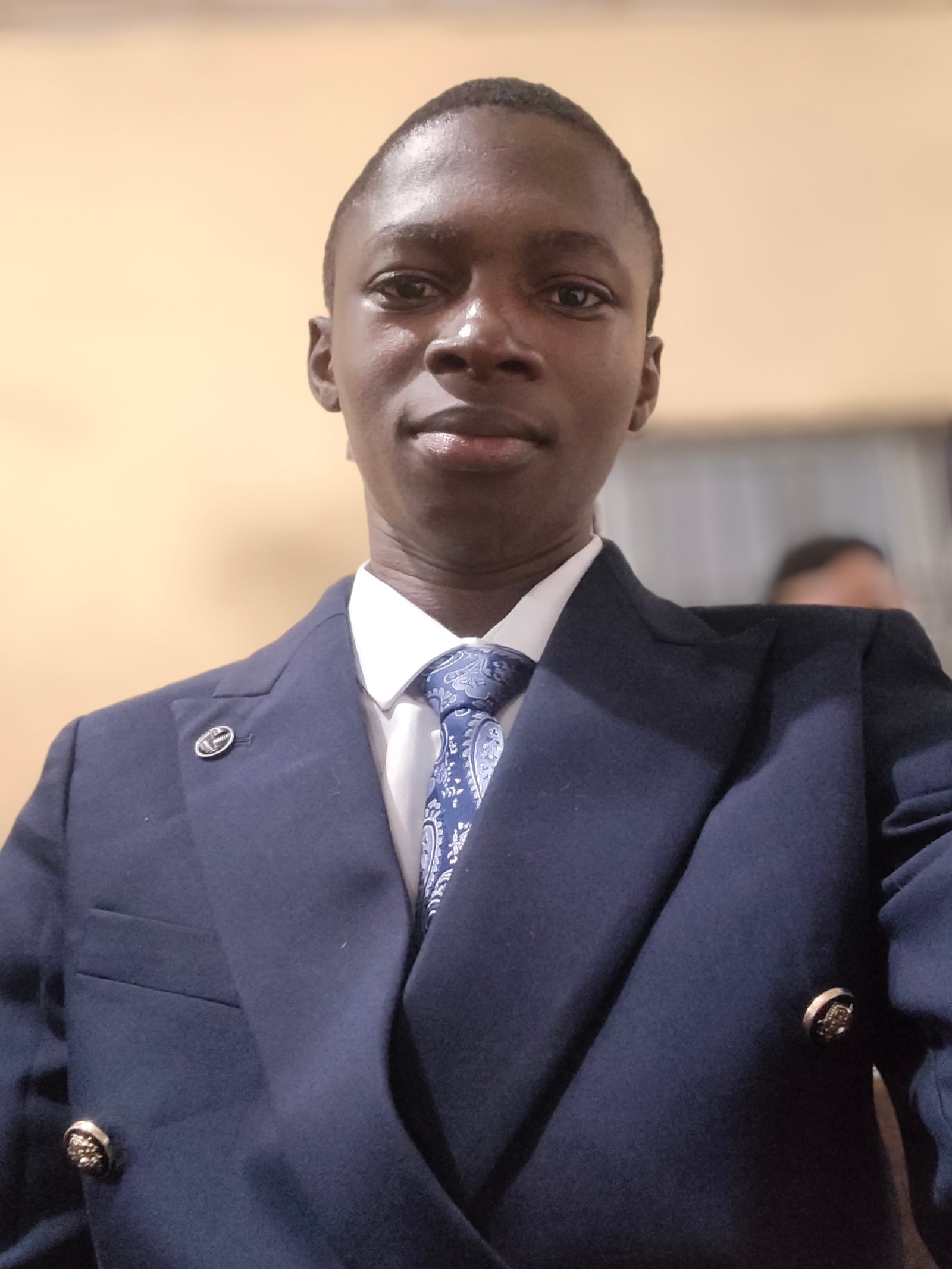 Peters Elijah in a navy suit